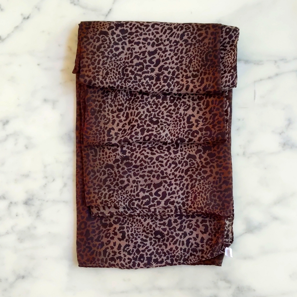 NWT. Large soft and lightweight multi shades of brown animal print scarf/wrap.